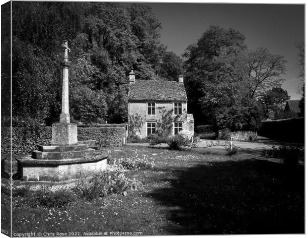 Cotswold cottage and war memorial Canvas Print by Chris Rose