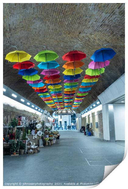 An array of colourful umbrellas at London Bridge Station. Print by johnseanphotography 