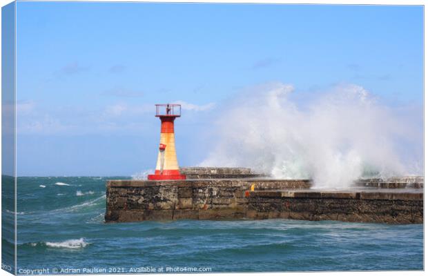 Large wave near lighthouse Canvas Print by Adrian Paulsen