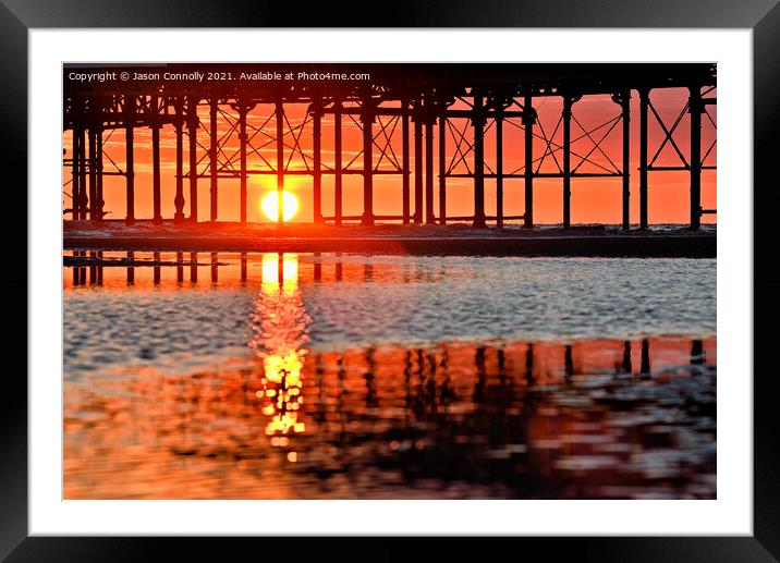 Under The Pier Sunset. Framed Mounted Print by Jason Connolly