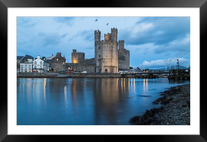 Caernarfon Castle at twilight Framed Mounted Print by Jason Wells