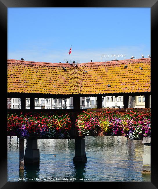 Colourful Bridge in Luzern Framed Print by Russell Deaney