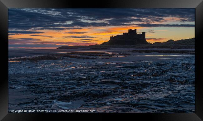 Majestic Sunrise at Bamburgh Castle Framed Print by David Thomas