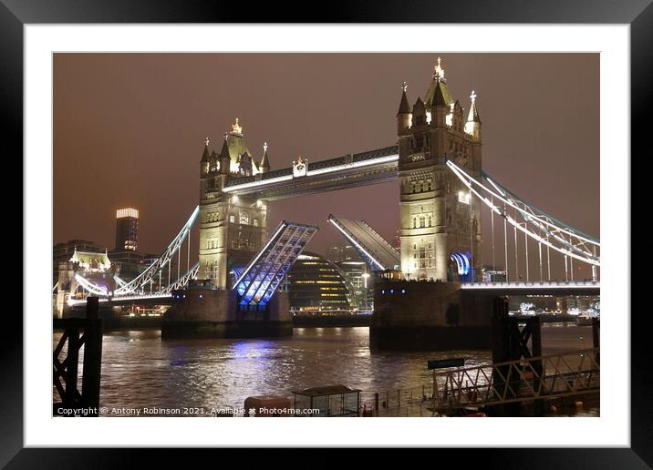 Tower Bridge awakens at night Framed Mounted Print by Antony Robinson