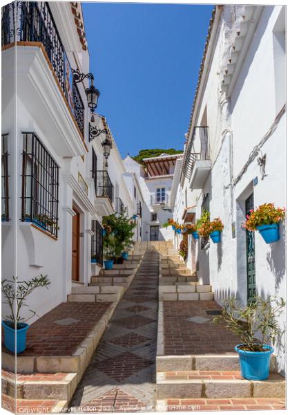 Steep street with blue plantpots, Mijas Canvas Print by Kevin Hellon
