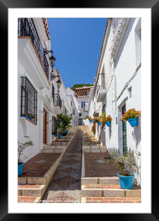 Steep street with blue plantpots, Mijas Framed Mounted Print by Kevin Hellon