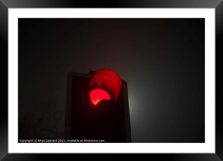 A british traffic light shines red, indicating sto Framed Mounted Print by Rhys Leonard
