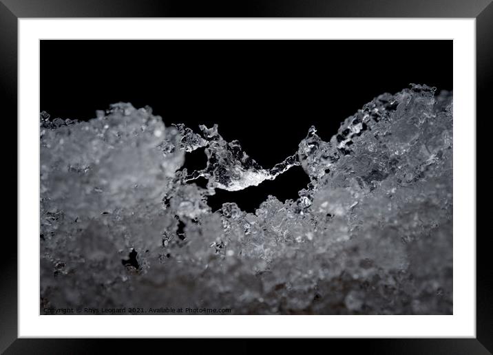 Super close up abstract image of slowly thawing snow. Macro detail Framed Mounted Print by Rhys Leonard