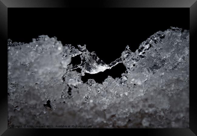 Super close up abstract image of slowly thawing snow. Macro detail Framed Print by Rhys Leonard