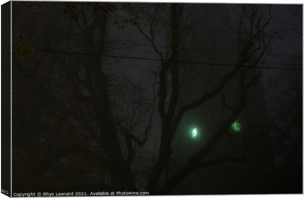 Eerie green clock face on a church tower shines through thick fog Canvas Print by Rhys Leonard