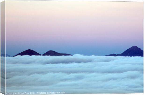 Cuillin Hills above the Clouds Canvas Print by Jon Pear