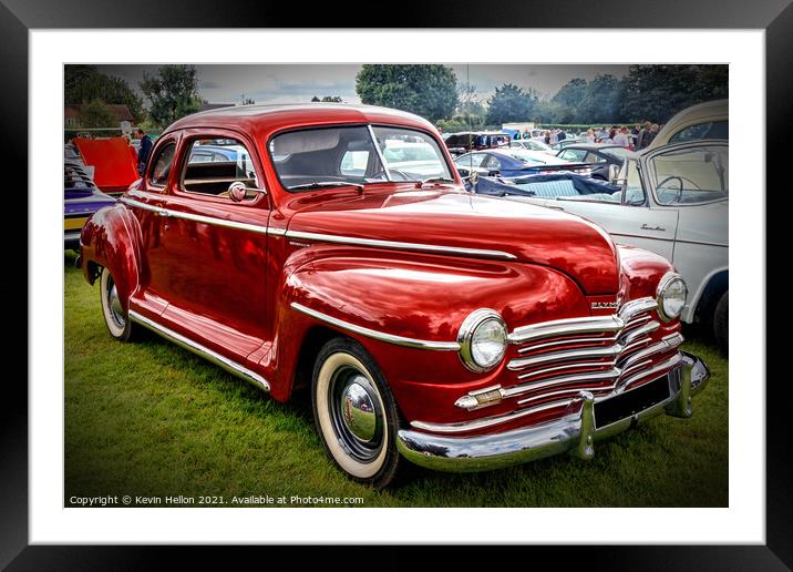 A red Plymouth Special Deluxe Coupe Framed Mounted Print by Kevin Hellon