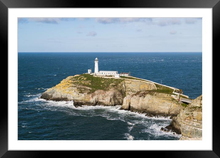 Waves crash around South Stack Lighthouse Framed Mounted Print by Jason Wells
