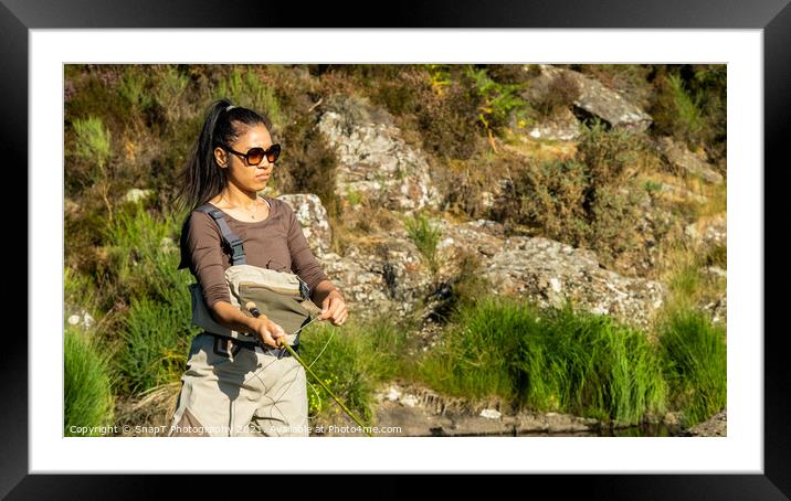A young asian female fly fishing on a river on a summers evening Framed Mounted Print by SnapT Photography