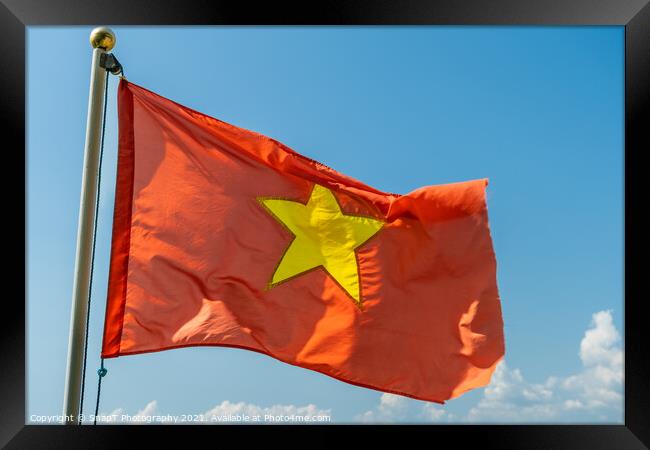 Close up of the red Vietnam National Flag with a gold star in the middle Framed Print by SnapT Photography