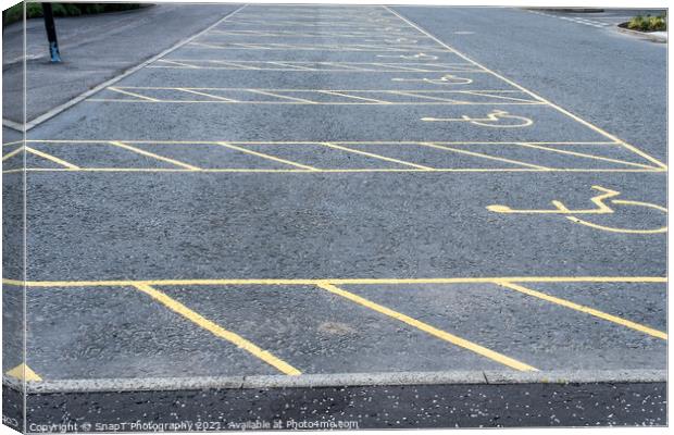 Numerous empty yellow marked disable vehicle parking spaces in a car park Canvas Print by SnapT Photography