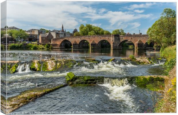 The River Nith flowing over the Caul weir in Dumfries, during summer in Scotland Canvas Print by SnapT Photography