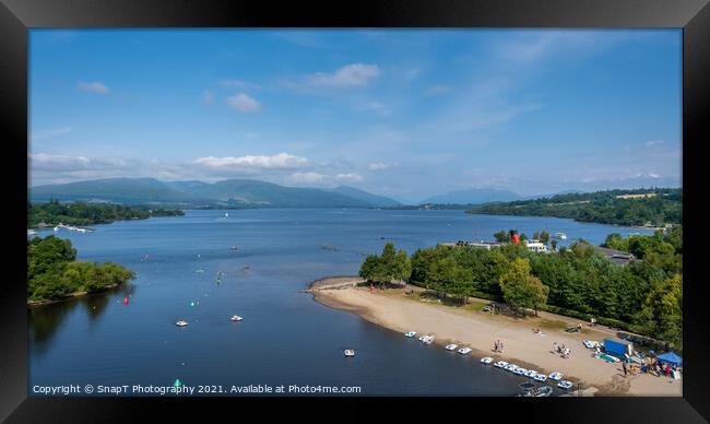 View over Loch Lomond from Lomond shores on a sunny summer day in Scotland Framed Print by SnapT Photography