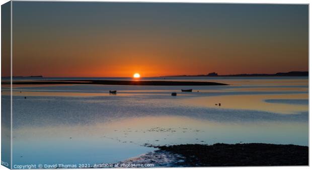 Majestic Sunrise over Lindisfarne Harbour Canvas Print by David Thomas