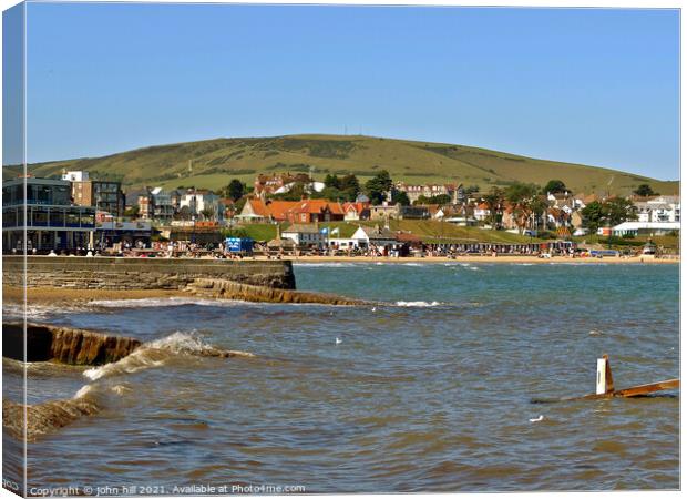 Swanage bay and seafront, Dorset, UK. Canvas Print by john hill