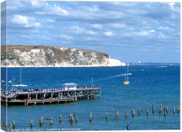 Old  & New piers, Swanage, Dorset. Canvas Print by john hill
