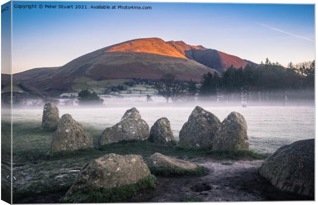 Sunrise at the Winter solstice at Castlerigg Stone Circle near K Canvas Print by Peter Stuart