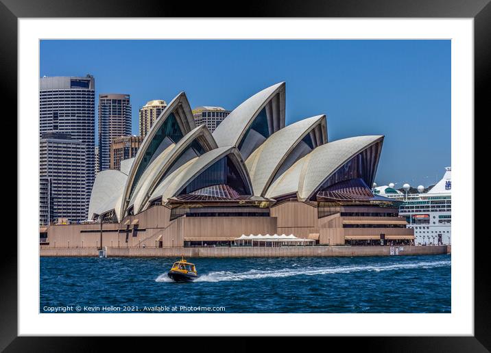 A boat powers past the Sydney Opera House, in the  Framed Mounted Print by Kevin Hellon