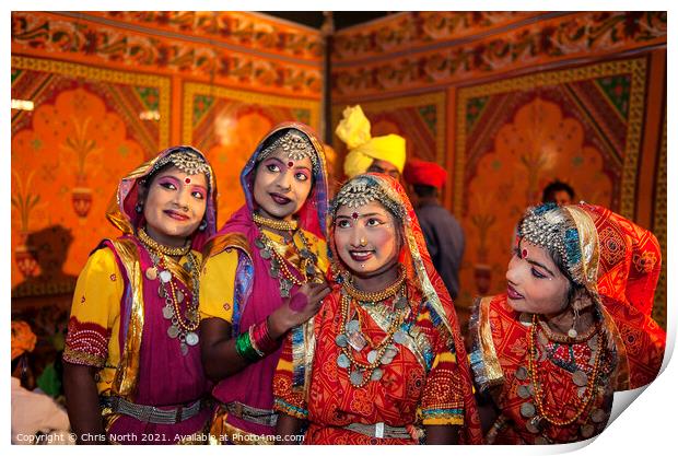 Dances in traditional costume at the Camel fair Jaisalmer. Print by Chris North