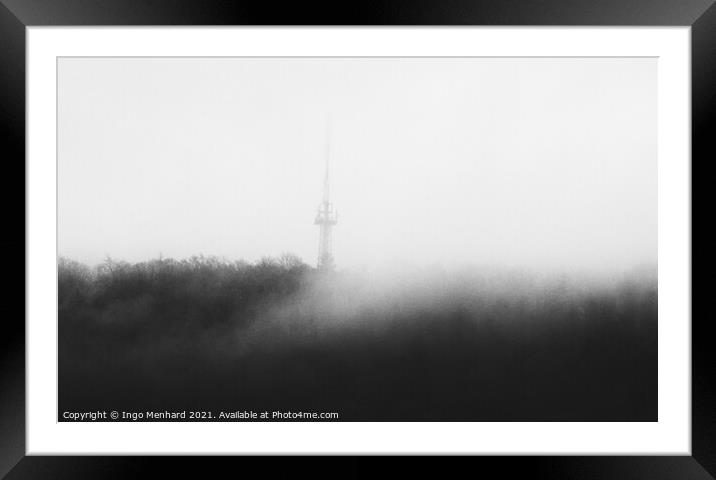 Mystic tower hidden in the woods behind the upcoming fog  Framed Mounted Print by Ingo Menhard