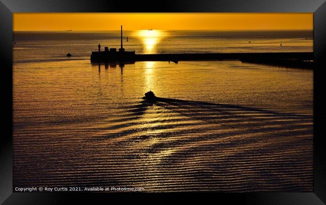 Leaving Port at Sunset. Framed Print by Roy Curtis