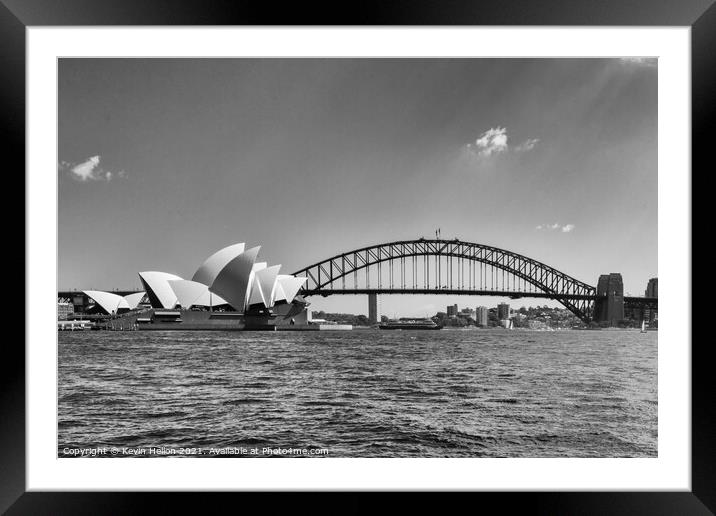 View of the Opera House in Sydney Harbor. The Sydney Harbour Bri Framed Mounted Print by Kevin Hellon