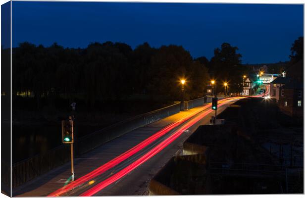 Traffic trails over the Old Dee Bridge Canvas Print by Jason Wells
