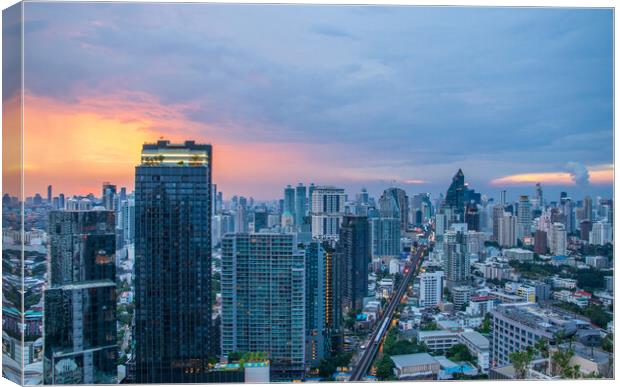 The Cityscape, the Railway of the Skytrain and the skyscraper of Bangkok in Thailand Southeast Asia at the Evening Canvas Print by Wilfried Strang
