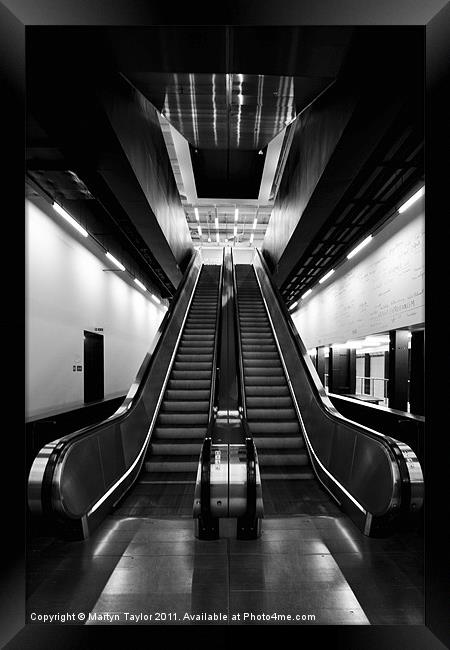 Escalator in Black and White Framed Print by Martyn Taylor