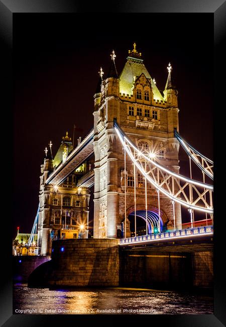 Tower Bridge In London Illuminated At Night Framed Print by Peter Greenway