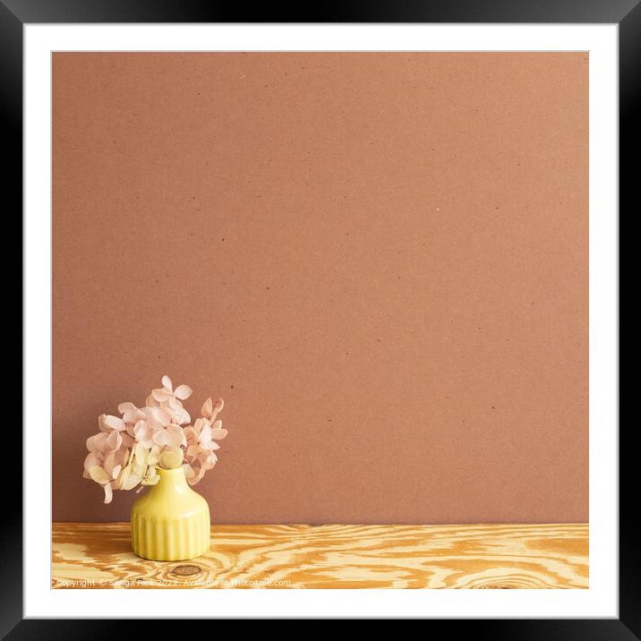 Vase of pink hydrangea flower on wooden table Framed Mounted Print by Sanga Park