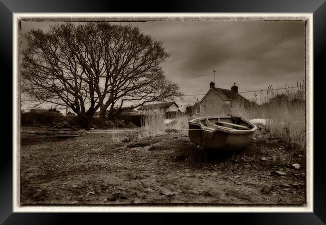 A boat on dry moorings Framed Print by Jim Butler