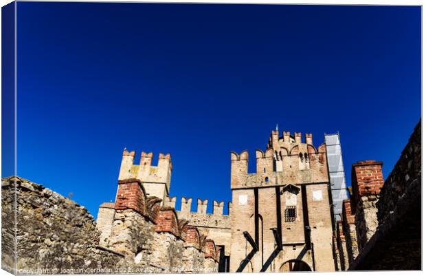 Facade of the castle of Sirmione surrounded by water. Canvas Print by Joaquin Corbalan