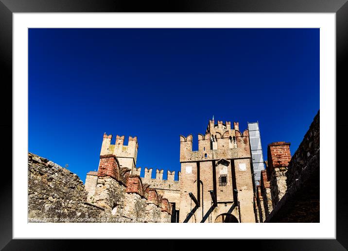 Facade of the castle of Sirmione surrounded by water. Framed Mounted Print by Joaquin Corbalan