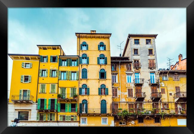 Faded and old facades of houses in the old town of the city of V Framed Print by Joaquin Corbalan