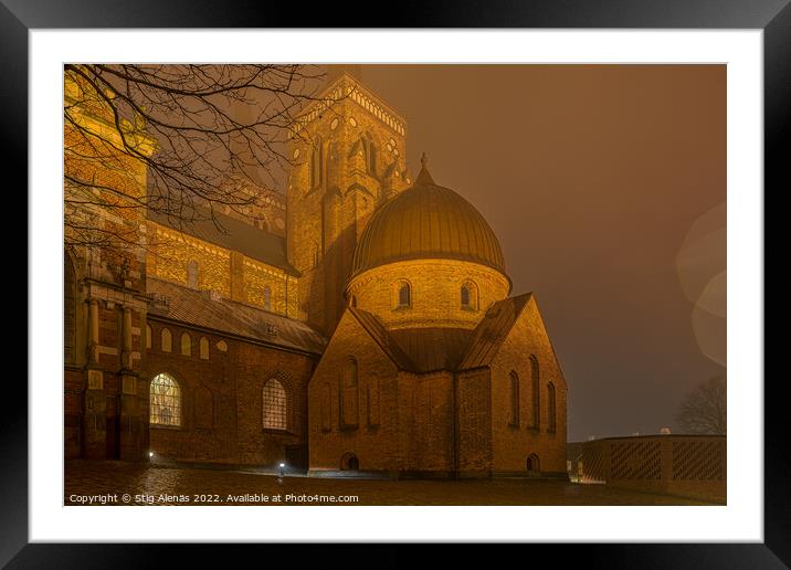 The illuminated Roskilde Cathedral a misty night  Framed Mounted Print by Stig Alenäs