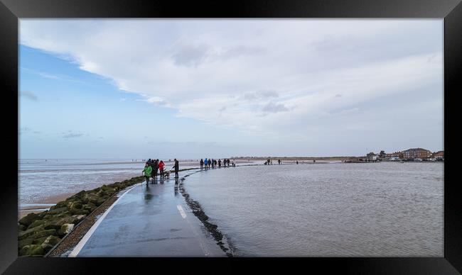 Families blowing out the cobwebs at West Kirby Framed Print by Jason Wells