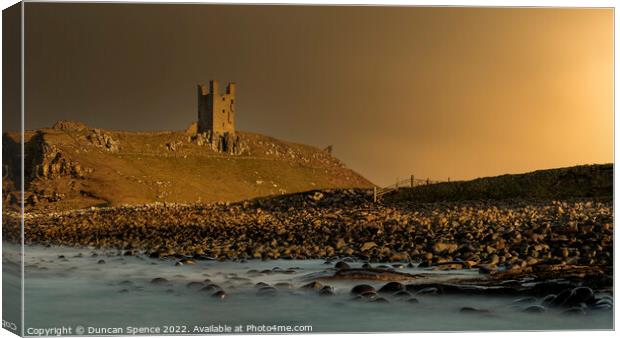 Dunstanburgh Castle at Sunset, Northumberland. Canvas Print by Duncan Spence