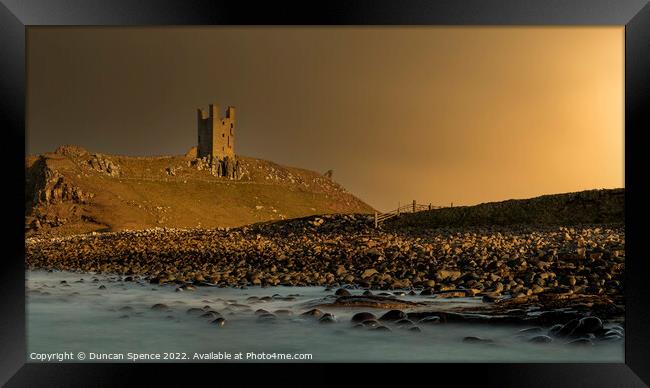Dunstanburgh Castle at Sunset, Northumberland. Framed Print by Duncan Spence