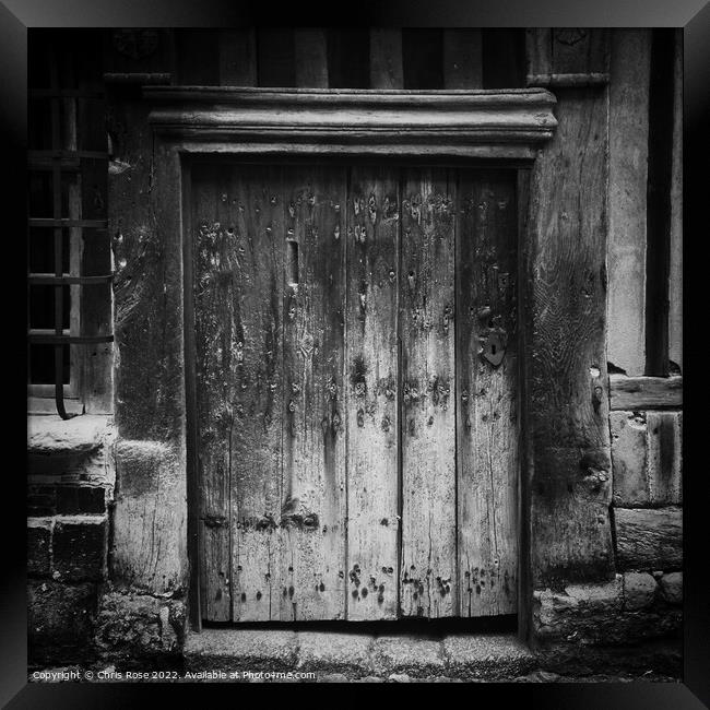 Weathered wooden door Framed Print by Chris Rose