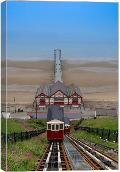 Saltburn cliff lift and pier on a summers day Canvas Print by Kevin Winter