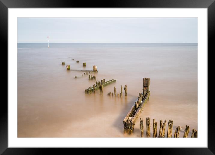Zig zag groyne at Hunstanton beach juts out into The Wash Framed Mounted Print by Jason Wells