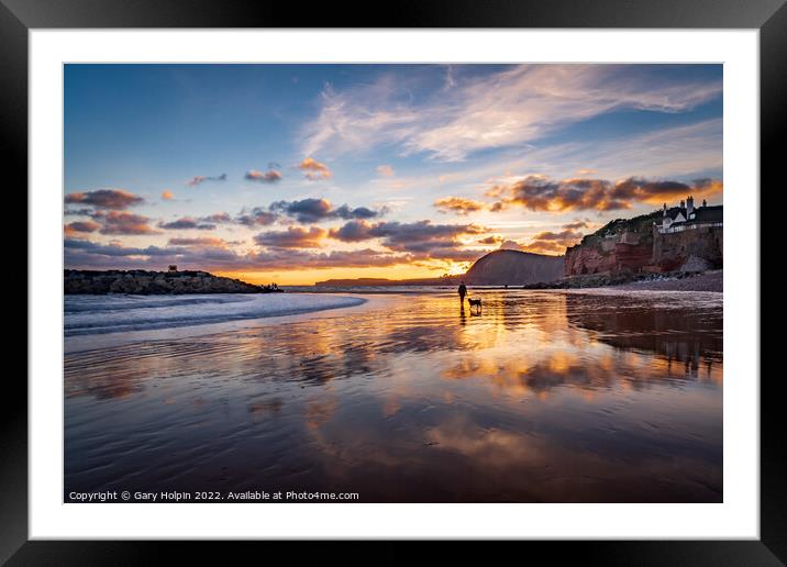 Dog walker at sunset on Sidmouth Beach Framed Mounted Print by Gary Holpin