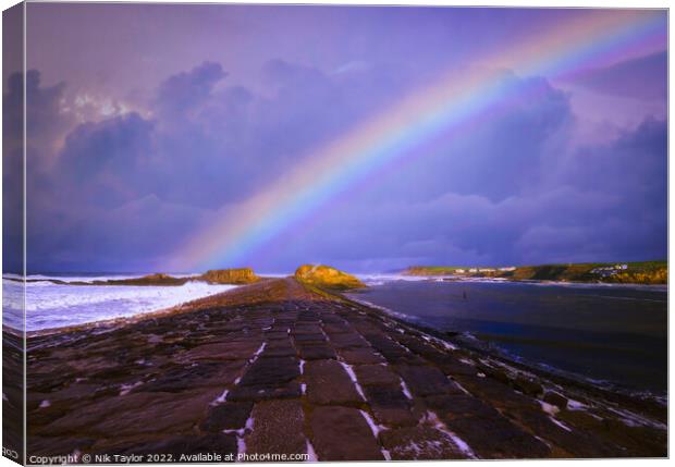 Rainbow over the Breakwater Canvas Print by Nik Taylor