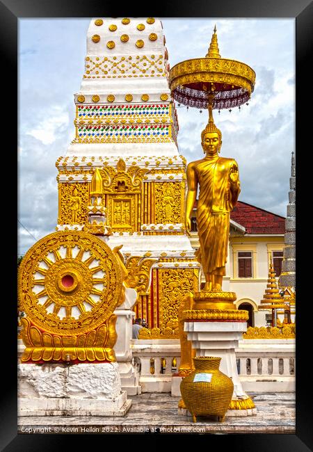 Buddha image and spire, Wat Phra That Phanom Framed Print by Kevin Hellon